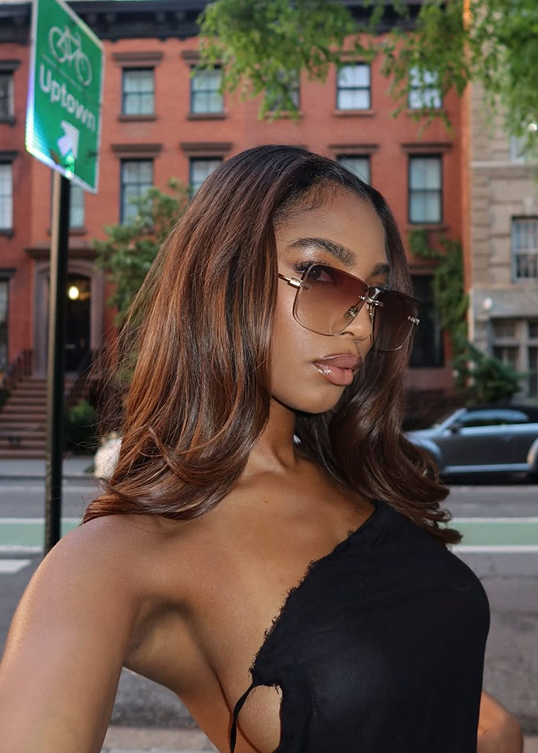 Dimensional brown hair on a city street